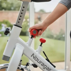 A hand adjusting the red tension knob on a magnetic resistance spin bike for smooth and quiet home workouts.