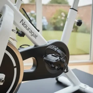 Close-up of non-slip pedals with adjustable toe cages, ideal for use with standard trainers or cycling shoes.