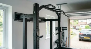 Adjustable height pull-up bar attachment on a heavy-duty steel folding power rack.