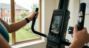 A digital display on a climber showing interval timers and heart rate tracking for HIIT routines.