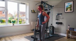 A beginner performing a seated row on an easy-to-use home multi-gym machine.